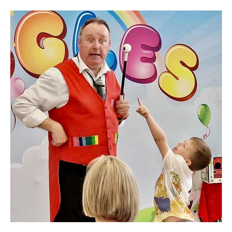 Bronze magic package entertainment showing magician with balloon modelling for smaller parties